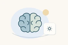 Two-tone brain symbol beside a circle surrounded by small dots.