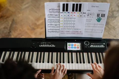 Hands at a piano keyboard during a lesson